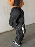 parachute trousers with cargo pockets and piping