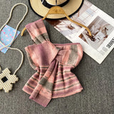 Design With Chic Kinescastic Striped One-Shoulder Sling Vest For Women Wearing A Short Coat Of