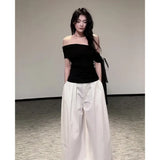 Beautiful Wearing A Suit Girl Little Hot Girl A Word On The Shoulder Wearing White Broad Leg Pants A Complete